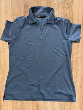 TravisMathew Women’s Blue Polo-Style Short Sleeve Top